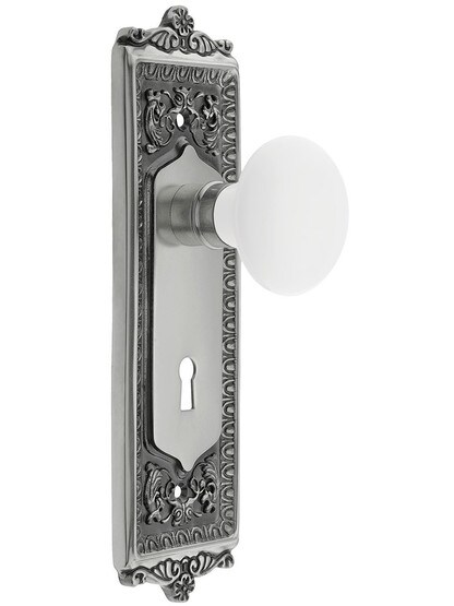 Egg and Dart Style Mortise Lock Set with White Porcelain Door Knobs in Antique Pewter.